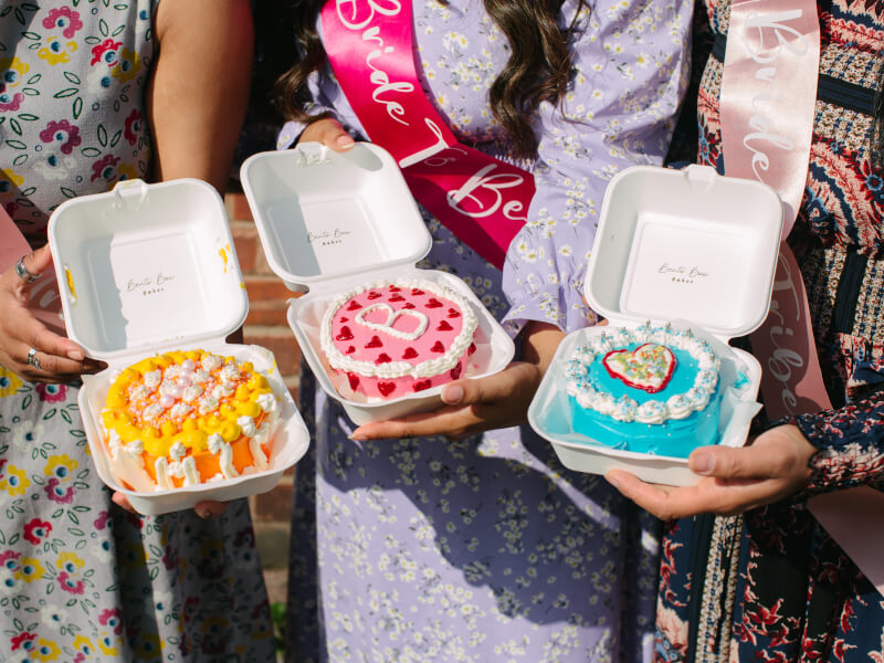 Beautifully decorated bento cakes in a box